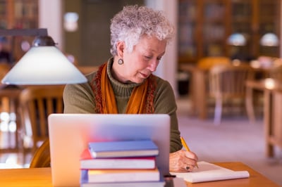 mature-university-woman-student-library