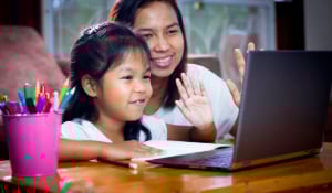 mom-daughter doing homework online