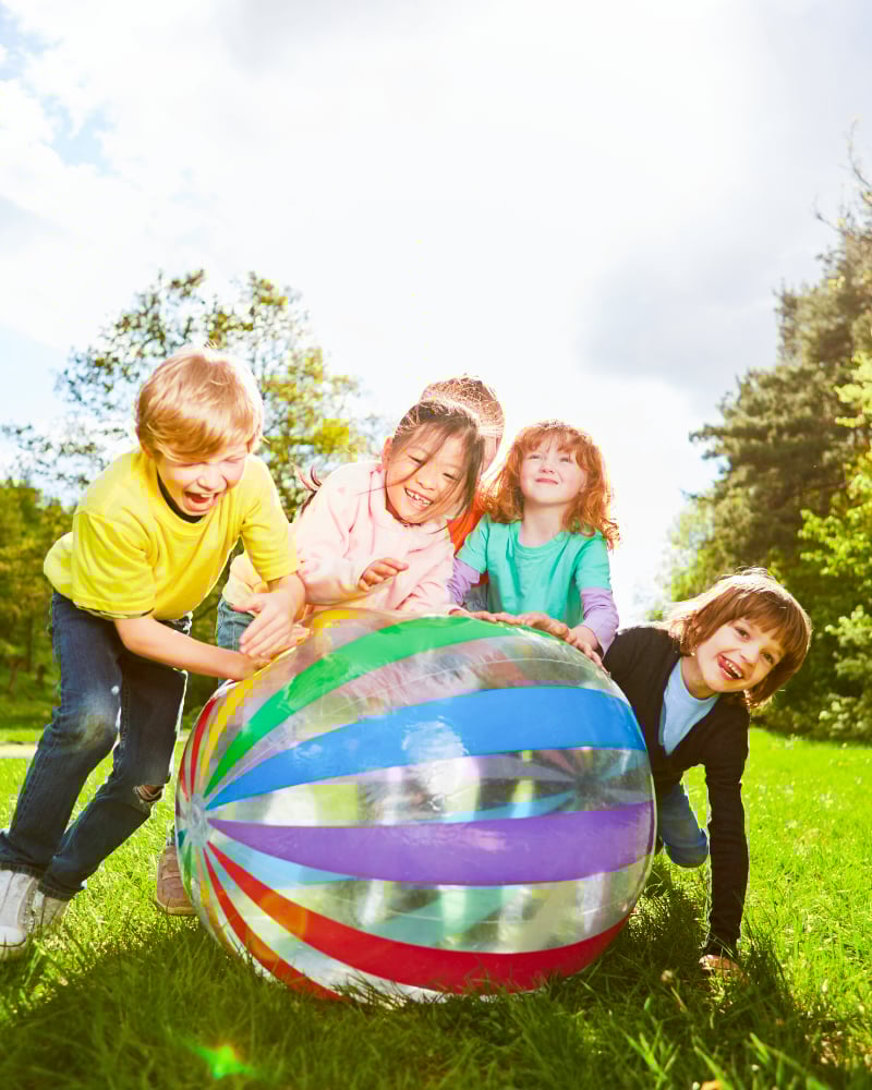 young children playing outdoors