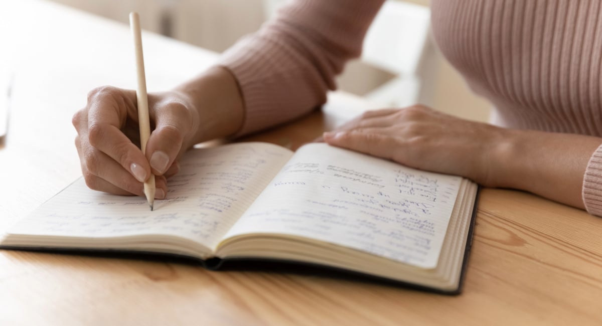 Student taking notes